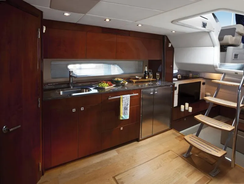 Slide: The Image of Manufacturer Provided Image: Luxurious kitchen area in 2013 Sea Ray 450 Sundancer yacht with modern amenities. - 6