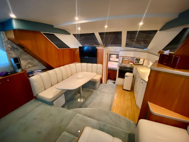 Slide: The Image of Luxurious interior of a 1997 Silverton 372 Motor Yacht with plush seating and modern amenities. - 22