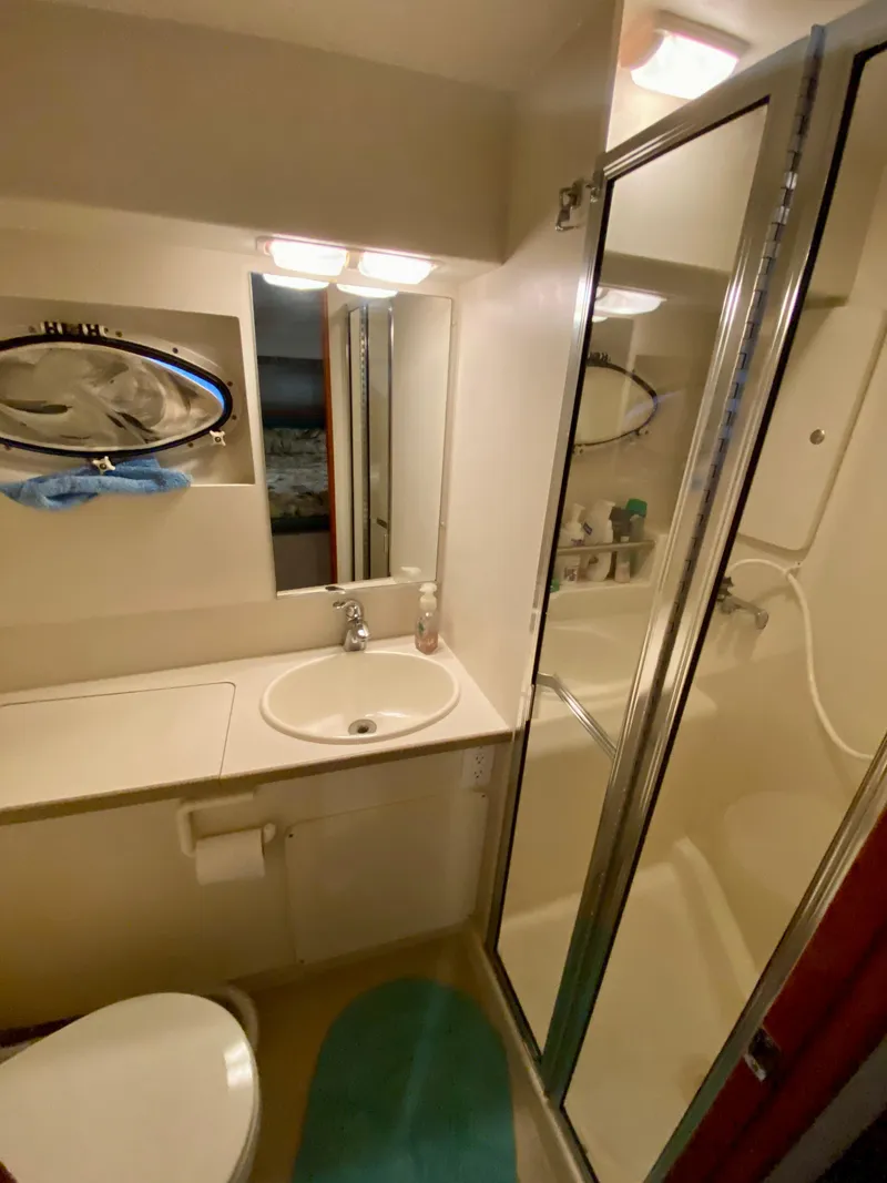 Slide: The Image of Bathroom interior of 1997 Silverton 372 Motor Yacht with shower and sink. - 31