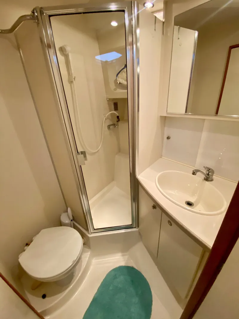 Slide: The Image of Bathroom of 1997 Silverton 372 Motor Yacht with shower, sink, and toilet. - 34