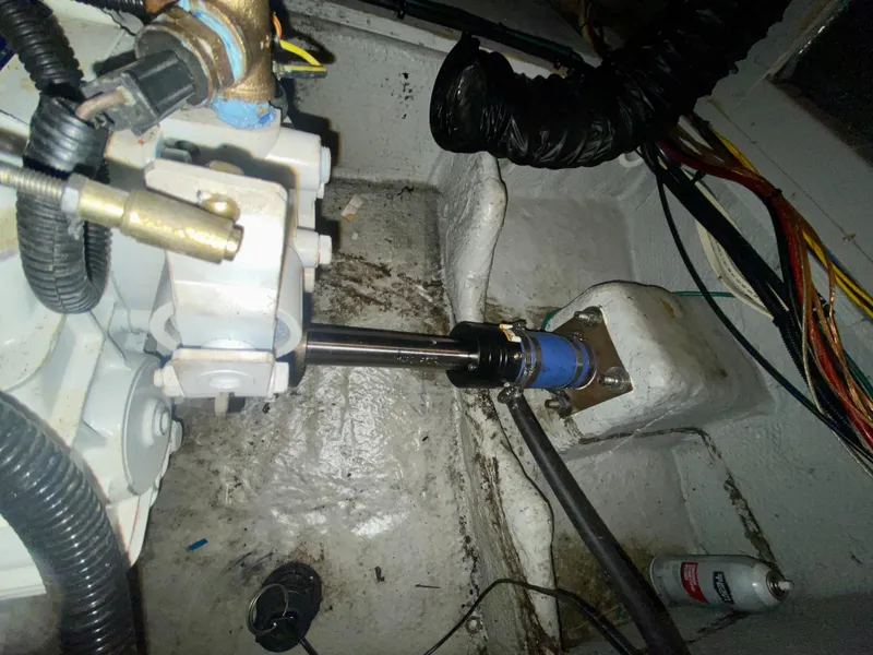 Slide: The Image of Engine compartment of a 1997 Silverton 372 Motor Yacht, showing mechanical components and wiring. - 37