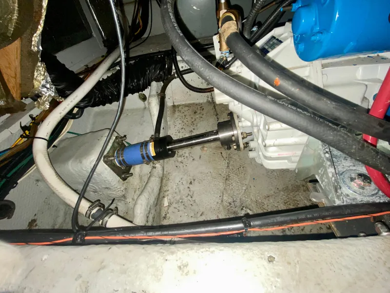 Slide: The Image of Engine compartment of a 1997 Silverton 372 Motor Yacht, showing mechanical components and wiring. - 38