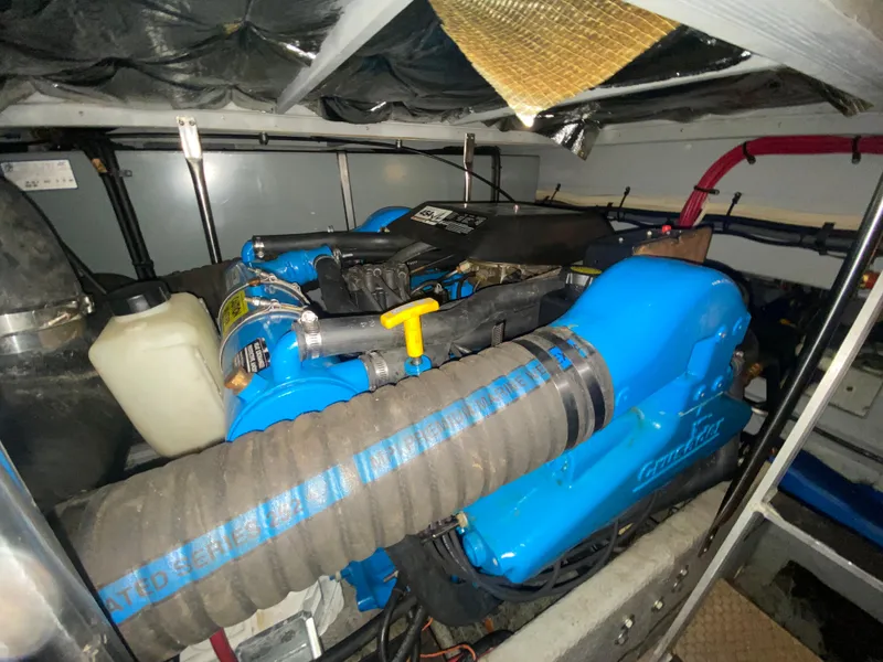 Slide: The Image of Engine compartment of a 1997 Silverton 372 Motor Yacht with blue Crusader engine. - 40