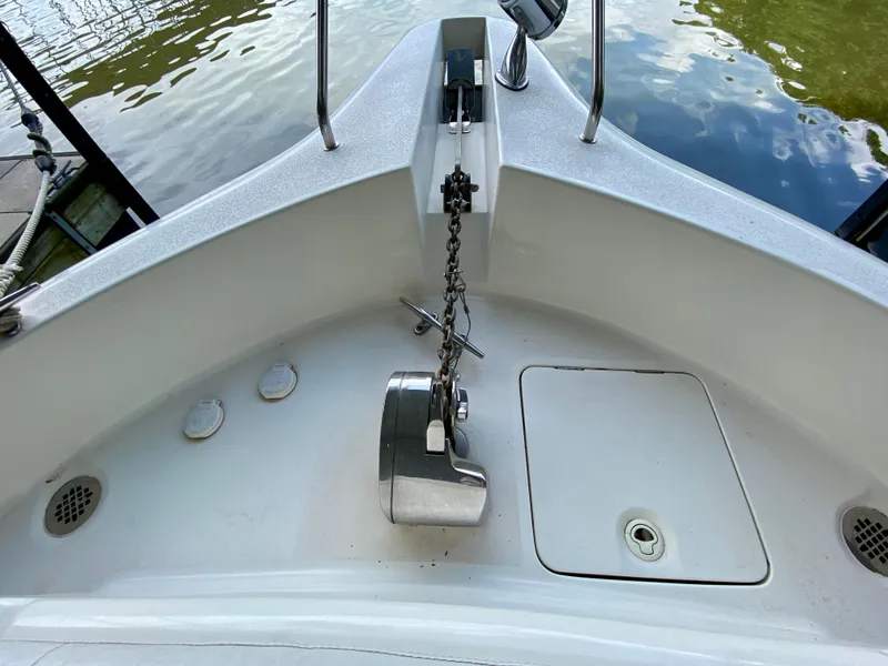 Slide: The Image of Bow of 1997 Silverton 372 Motor Yacht with anchor chain and water reflection. - 6