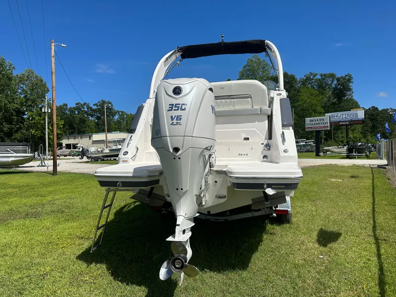 Slide: The Image of 2024 Regal 26 XO boat with Yamaha 350 V6 engine, displayed outdoors. - 13