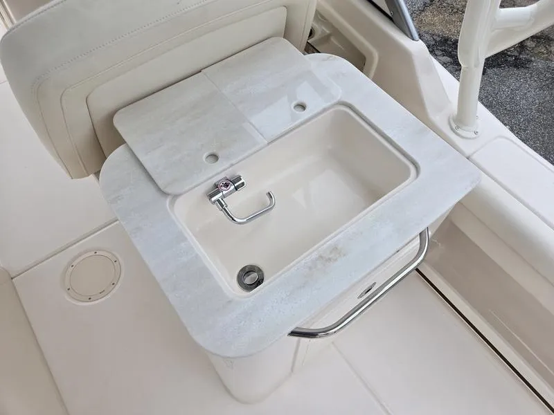 Slide: The Image of 2026 Grady-White Freedom 255 boat sink with sleek design and modern fixtures. - 16