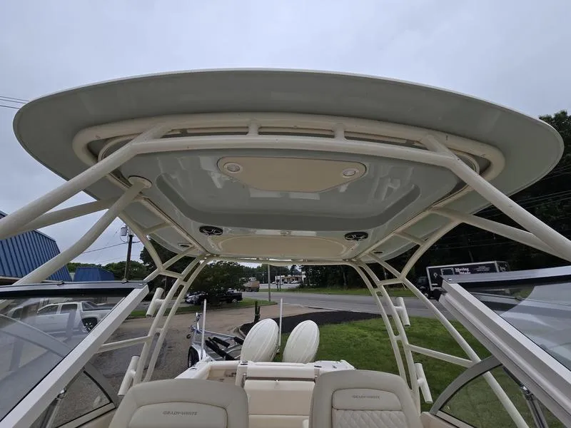 Slide: The Image of 2026 Grady-White Freedom 255 boat interior, featuring a sturdy hardtop and comfortable seating. - 17