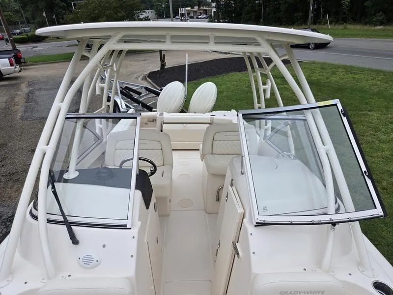 Slide: The Image of 2026 Grady-White Freedom 255 boat interior with seating and open windshield. - 22