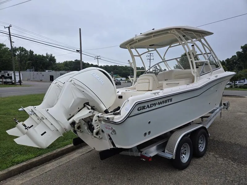 Slide: The Image of 2026 Grady-White Freedom 255 boat on trailer, featuring Yamaha outboard motor. - 8