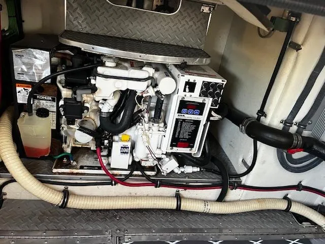 Slide: The Image of Engine compartment of a 2006 Formula 34 Performance Cruiser with visible Kohler generator. - 3