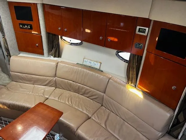 Slide: The Image of Luxurious interior of 2006 Formula 34 Performance Cruiser with leather seating and wooden cabinetry. - 4
