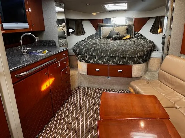 Slide: The Image of Interior of 2006 Formula 34 Performance Cruiser with bed, kitchenette, and seating area. - 6