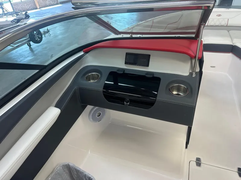 Slide: The Image of 2022 Regal LX4 boat interior with cup holders and seating. - 10