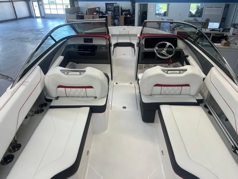 Slide: The Image of 2022 Regal LX4 boat interior with white seating, red accents, and modern dashboard. - 5