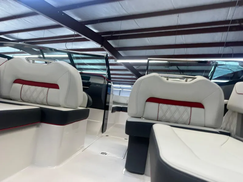Slide: The Image of Luxurious interior of 2022 Regal LX4 boat with white and red seating. - 6