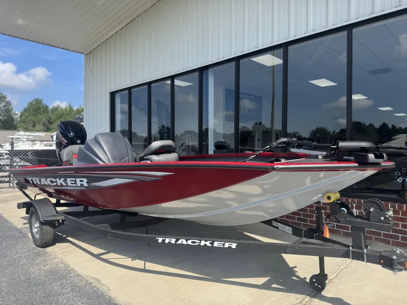 Slide: The Image of 2026 Tracker Pro Team 175 Crappie Edition boat displayed outside dealership. - 11