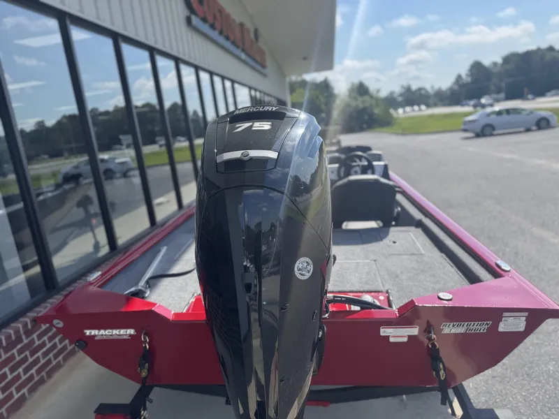 Slide: The Image of 2026 Tracker Pro Team 175 Crappie Edition boat with Mercury 75 engine, parked outdoors. - 5
