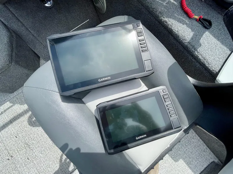 Slide: The Image of Two Garmin fish finders on a 2020 Tracker Pro Guide V-175 Combo boat seat. - 17