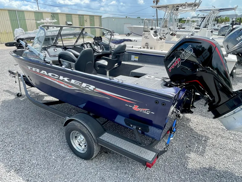Slide: The Image of 2020 Tracker Pro Guide V-175 Combo boat with Mercury Pro XS engine on trailer. - 2