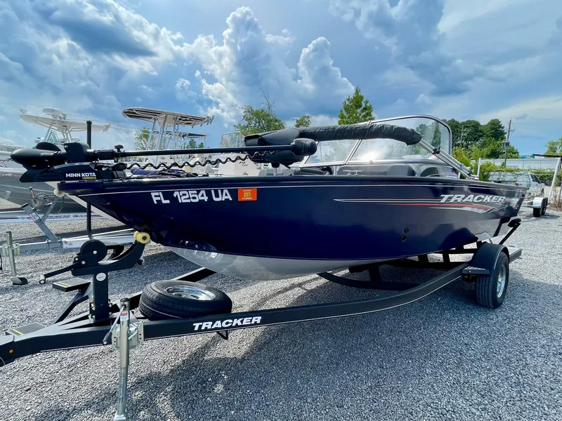 Slide: The Image of 2020 Tracker Pro Guide V-175 Combo boat on trailer under cloudy sky. - 5