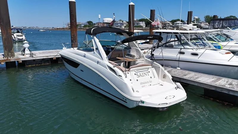 Slide: The Image of 2017 Sea Ray Sundancer 280 docked at marina, clear blue sky, calm water. - 3