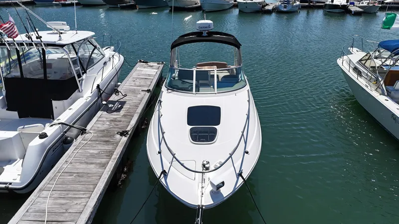 Slide: The Image of 2017 Sea Ray Sundancer 280 docked at marina, surrounded by other boats. - 6
