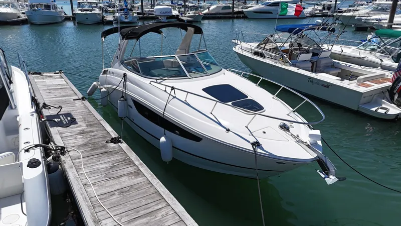 Slide: The Image of 2017 Sea Ray Sundancer 280 docked at marina, surrounded by other boats. - 7