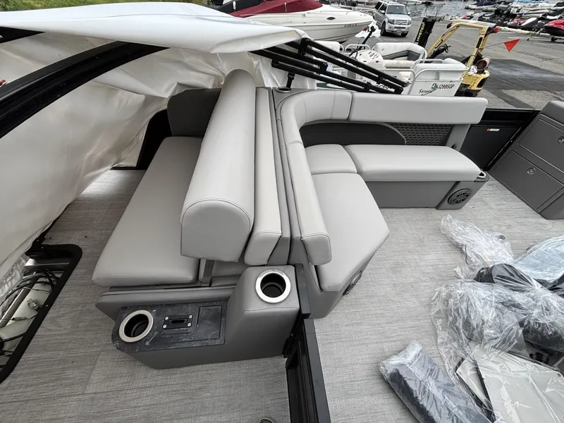Slide: The Image of Luxurious seating on 2023 Qwest Lanai 822 boat, featuring modern design and cup holders. - 4