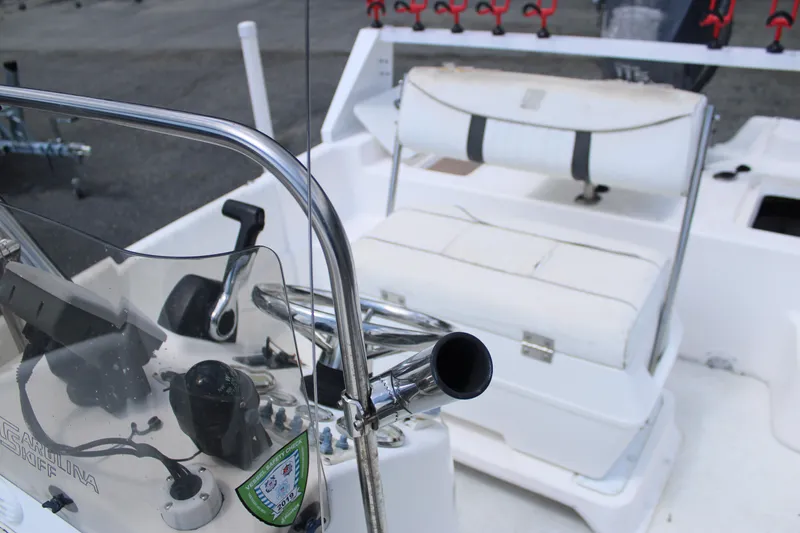 Slide: The Image of 2010 Carolina Skiff 2180 DLX boat interior with seating and control panel. - 16