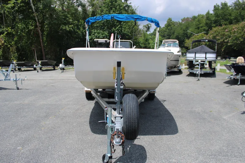 Slide: The Image of 2010 Carolina Skiff 2180 DLX boat on trailer, parked outdoors. - 5