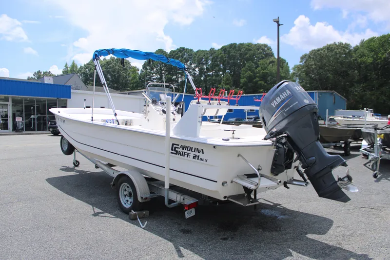 Slide: The Image of 2010 Carolina Skiff 2180 DLX boat with Yamaha outboard motor on trailer. - 7