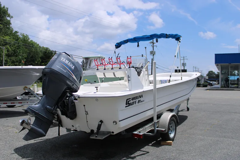 Slide: The Image of 2010 Carolina Skiff 2180 DLX boat with Yamaha outboard motor on trailer. - 9