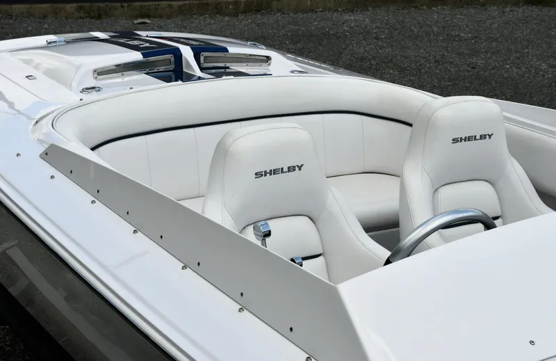 Slide: The Image of 2007 Donzi Carol Shelby 22 Classic boat interior with white seats and Shelby branding. - 10