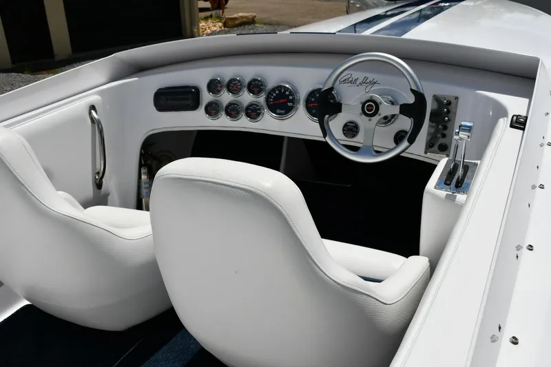 Slide: The Image of 2007 Donzi Carol Shelby 22 Classic boat interior with white seats and dashboard gauges. - 8