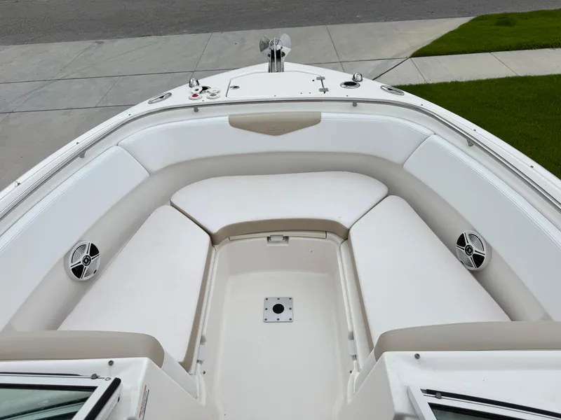 Slide: The Image of 2018 Robalo R247 Dual Console boat with spacious seating and modern design. - 21