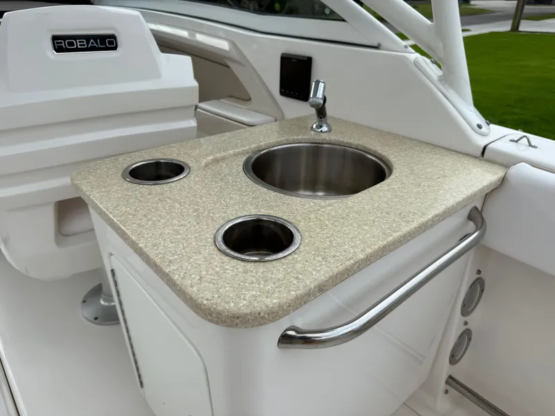 Slide: The Image of 2018 Robalo R247 Dual Console boat sink and countertop detail. - 27