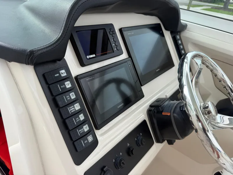 Slide: The Image of 2018 Robalo R247 Dual Console dashboard with Garmin and Yamaha displays. - 28