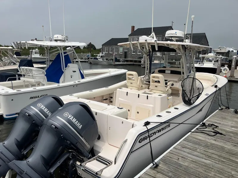 Slide: The Image of 2006 Grady-White Bimini 306 boat docked with Yamaha engines. - 0
