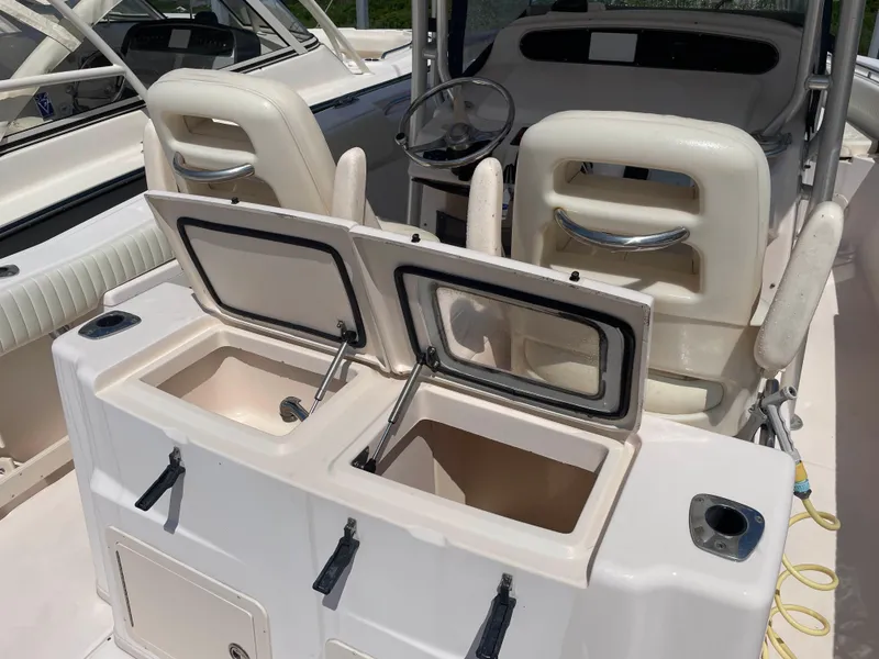 Slide: The Image of 2006 Grady-White Bimini 306 boat interior with open storage compartments. - 23