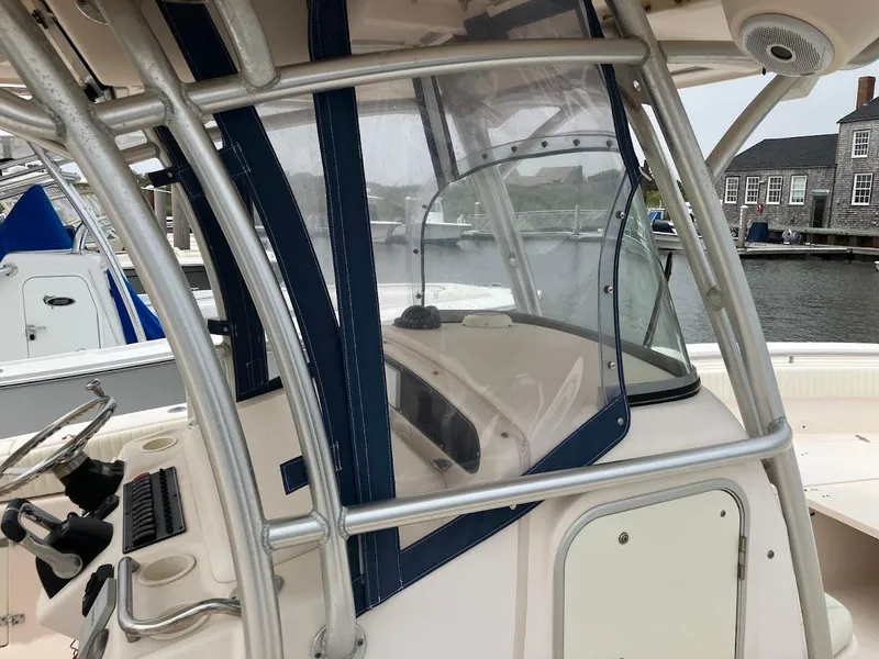 Slide: The Image of 2006 Grady-White Bimini 306 boat console with protective enclosure at marina. - 5