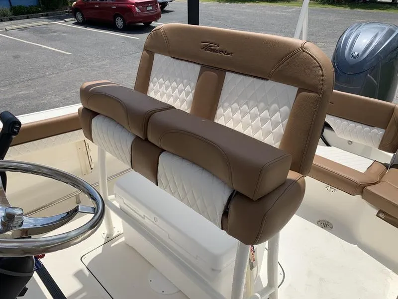 Slide: The Image of 2026 Pioneer ISLANDER 202 boat seat with tan and white diamond stitching. - 11