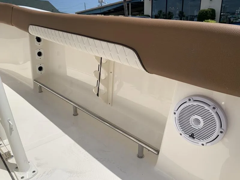 Slide: The Image of 2026 Pioneer ISLANDER 202 boat interior with speaker and cushioned railing. - 20