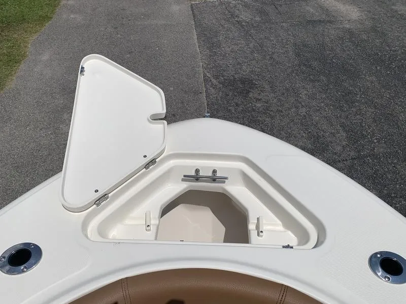 Slide: The Image of Open storage compartment on 2026 Pioneer ISLANDER 202 boat deck. - 29