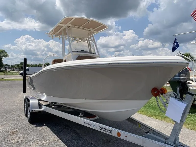 Slide: The Image of 2026 Pioneer ISLANDER 202 boat on trailer under cloudy sky. - 6