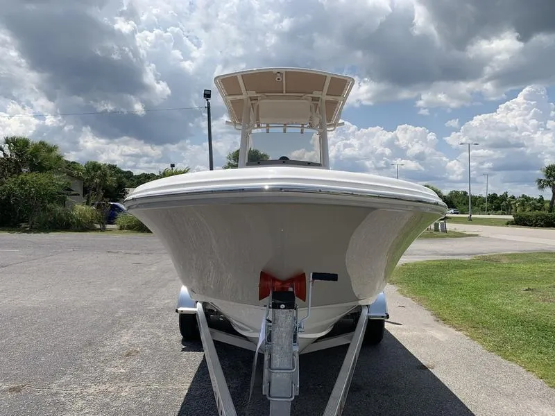 Slide: The Image of 2026 Pioneer ISLANDER 202 boat on trailer under cloudy sky. - 7