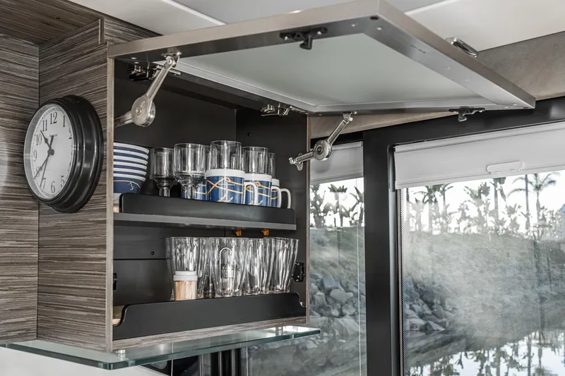 Slide: The Image of Open cabinet with glassware and dishes in 2020 Tiara Yachts 39 Coupe interior. - 13