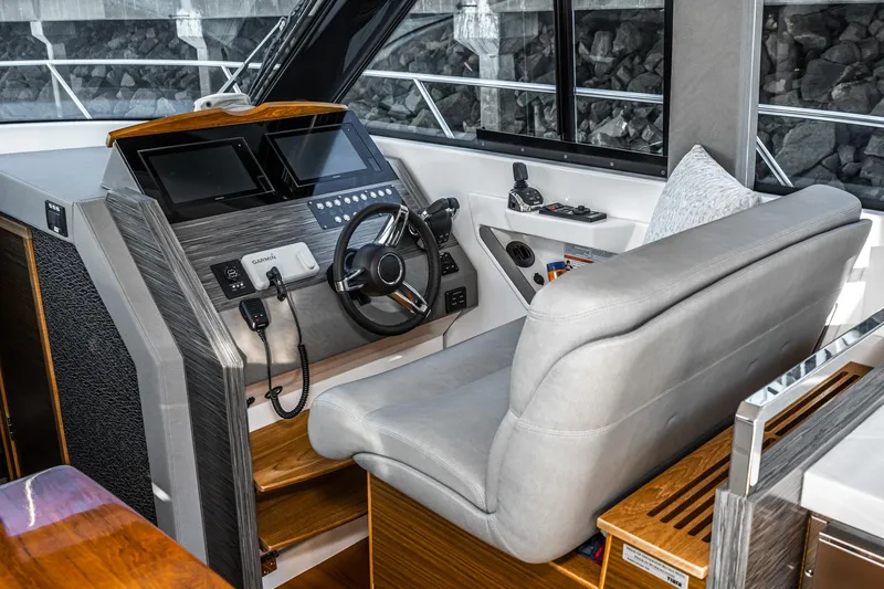 Slide: The Image of 2020 Tiara Yachts 39 Coupe helm with modern controls and comfortable seating. - 20