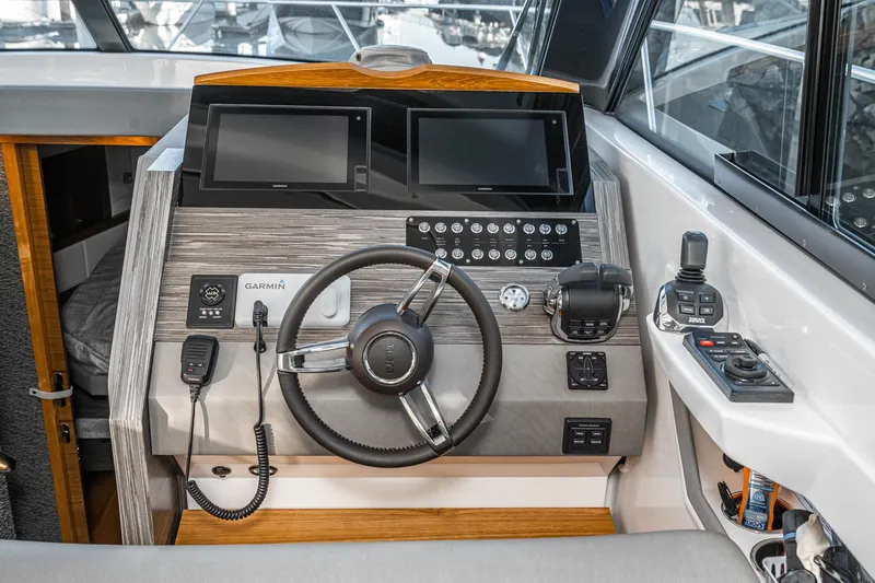 Slide: The Image of 2020 Tiara Yachts 39 Coupe helm with dual displays and modern controls. - 21
