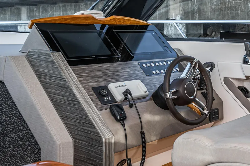 Slide: The Image of Helm of 2020 Tiara Yachts 39 Coupe with modern navigation equipment and steering wheel. - 22
