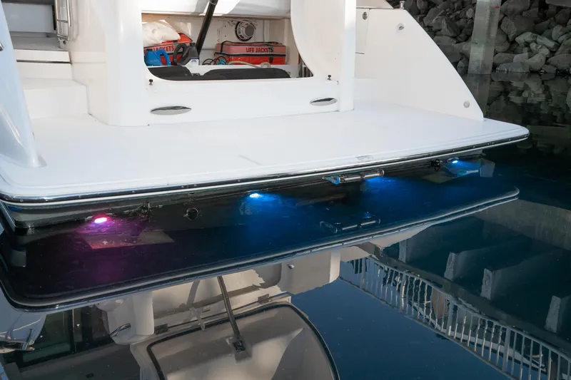 Slide: The Image of 2020 Tiara Yachts 39 Coupe with illuminated swim platform and underwater lights. - 3